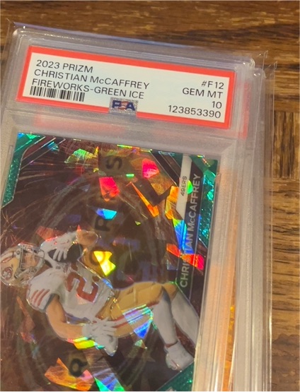 2023 Panini Prizm #F12 Christian McCaffrey Fireworks Green Ice — front