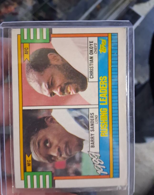 1990 Topps #28 Rushing Leaders Barry Sanders / Christian Okoye — front