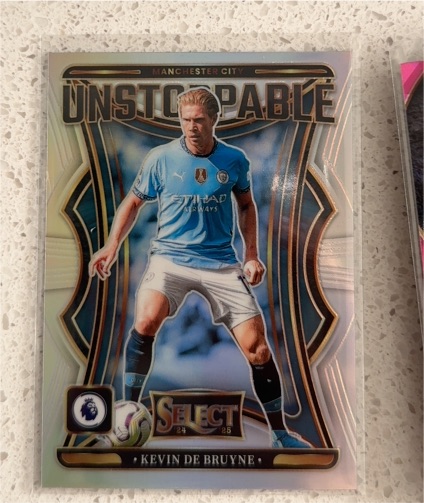 2024-25 Panini Select Premier League Unstoppable Prizm #11 Kevin De Bruyne — front
