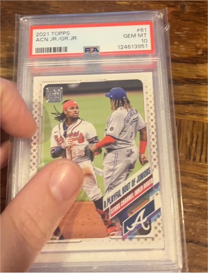 2021 Topps #61 A Playful Bout of Juniors Ronald Acuna Jr. Vladimir Guerrero Jr. — front