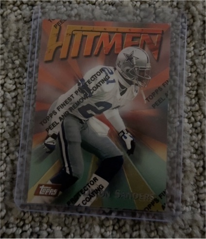 1997 Topps Finest Hitmen #90 Deion Sanders — front
