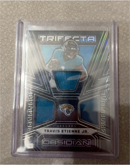 2023 Panini Obsidian #TRI-TET Travis Etienne Jr. — front