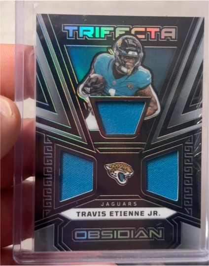 2023 Panini Obsidian #TRI-TET Travis Etienne Jr. — front