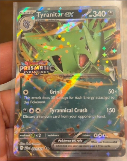 2016 Pokémon Sun & Moon Prismatic Evolutions #064 Tyranitar ex — front