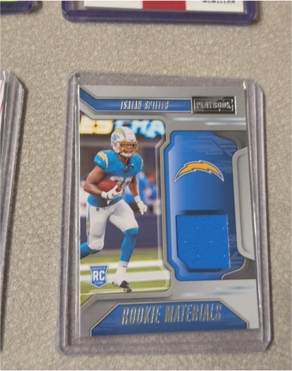 2022 Panini Playbook Rookie Materials #16 Isaiah Spiller — front