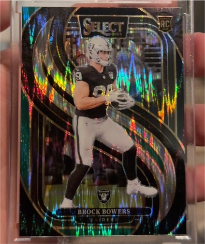2024 Panini Select #118 Brock Bowers Premier Level Red & Yellow Shock Prizm RC — front