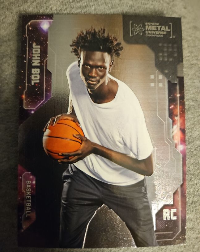 2024 Skybox Metal Universe Champions #81 John Bol Rookie — front