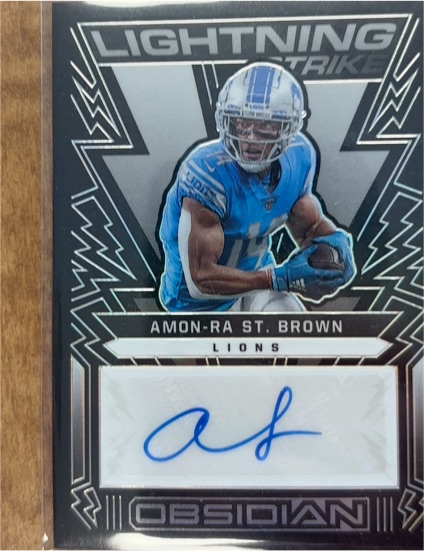 2022 Panini Obsidian Lightning Strike #LS-AST Amon-Ra St. Brown — front