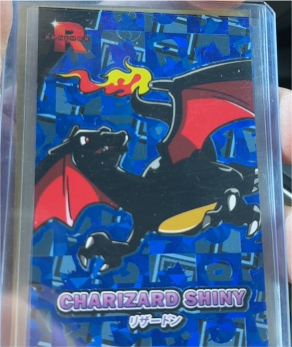2025 Pokémon Team Rocket Charizard Shiny Cracked Ice Holo Card Database — front