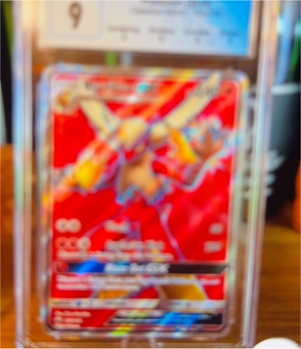 2019 Pokémon TCG Cosmic Eclipse #22 Reshiram & Charizard GX — front