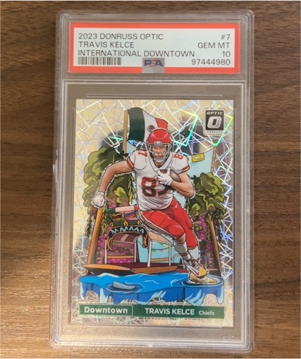 2023 Panini Donruss Optic #7 Travis Kelce International Downtown — front