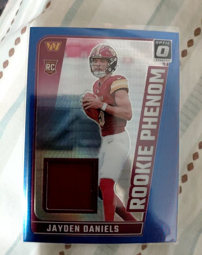 2024 Panini Donruss Optic #RPB-JDS Jayden Daniels Rookie Phenom Blue Hyper Patch — front