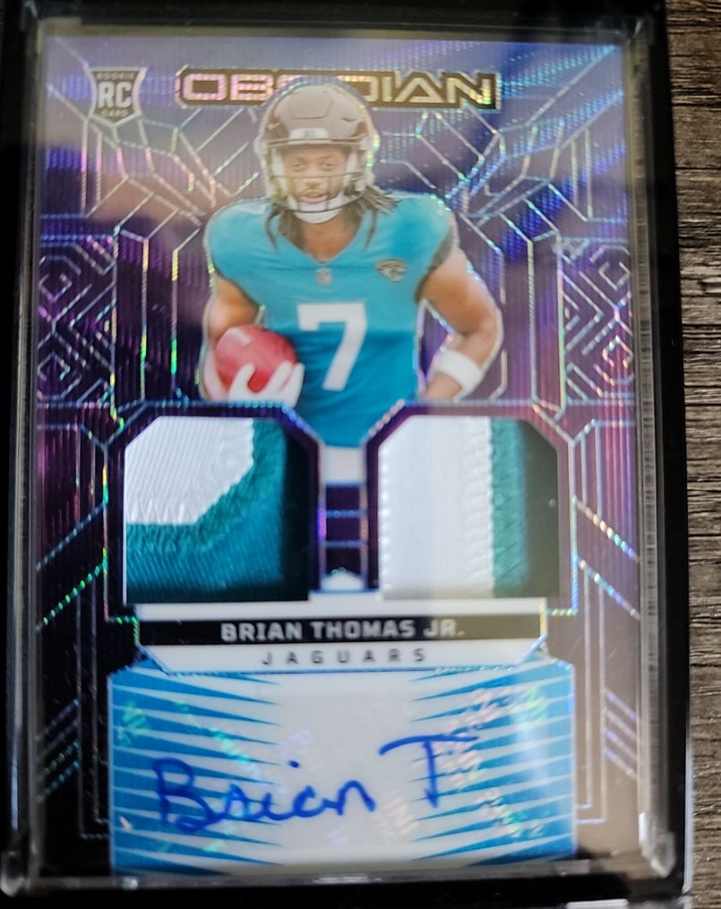 2024 Panini Obsidian Rookie Materials Ink #RMI-BTJ Brian Thomas Jr. — front