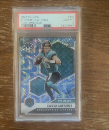2021 Panini Mosaic #241 Trevor Lawrence NFL Debut Reactive Blue Rookie Card — front