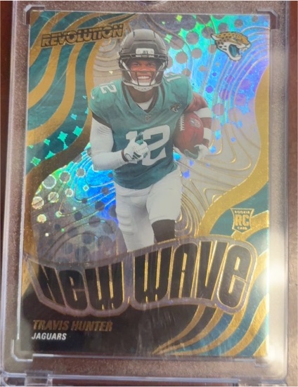 2025 Panini Revolution #7 Travis Hunter New Wave Rookie — front