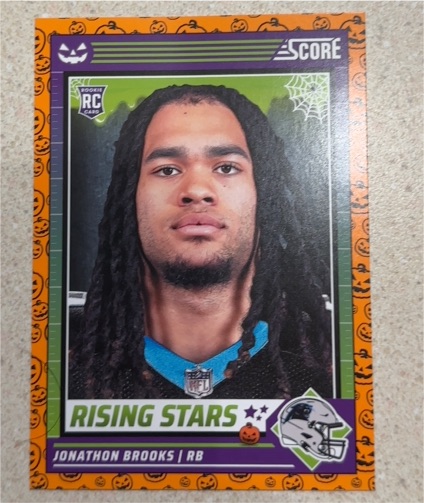 2024 Panini Score-A-Treat #30 Jonathon Brooks Rising Stars Orange Pumpkin Rookie — front