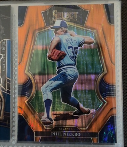 2023 Panini Select Premier Level Orange Flash Prizm #112 Phil Niekro — front