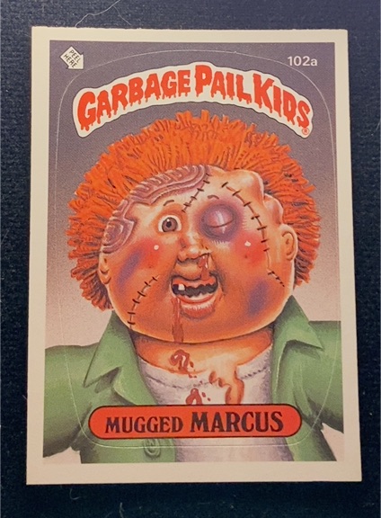 1986 Topps Garbage Pail Kids Series 3 #102a Mugged Marcus — front
