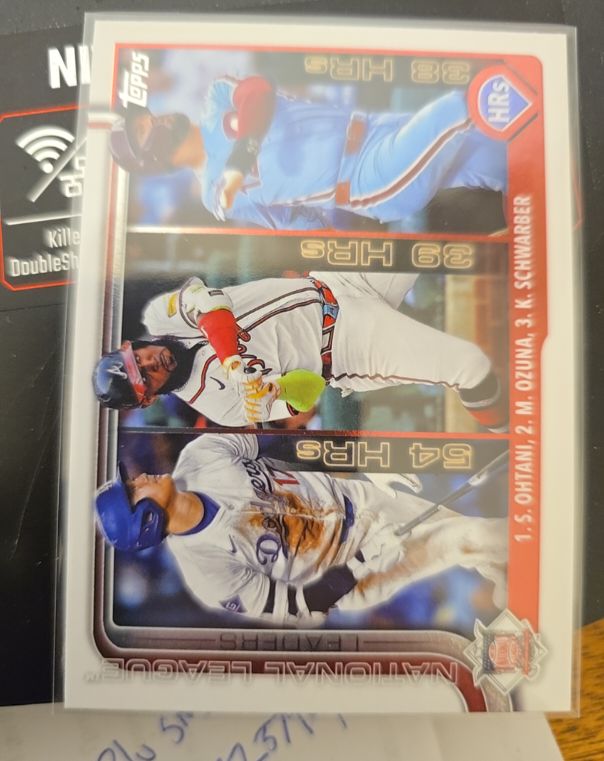 2025 Topps Series 1 #144 National League HR Leaders Shohei Ohtani / Marcell Ozuna / Kyle Schwarber — front