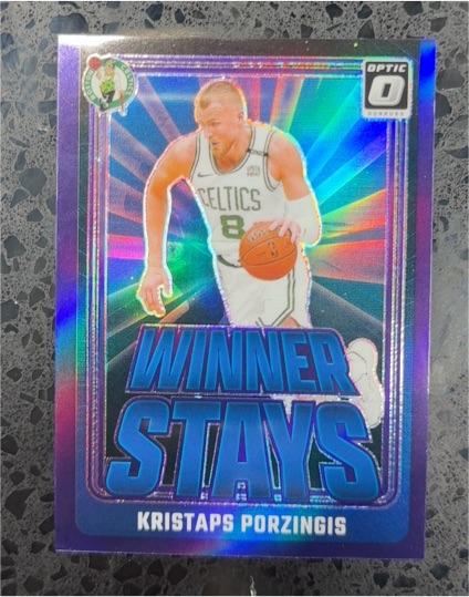 2024-25 Panini Donruss Optic #9 Kristaps Porzingis Winner Stays Purple Prizm — front