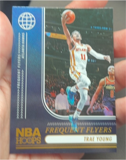 2024-25 Panini NBA Hoops Frequent Flyers #12 Trae Young — front