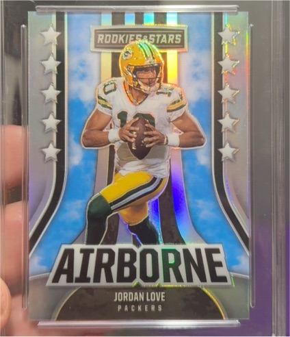 2023 Panini Rookies & Stars #AI-12 Jordan Love Airborne Silver Prizm — front