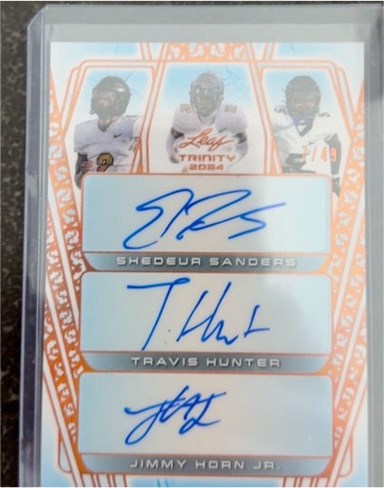 2024 Leaf Trinity Triple Auto #12/49 Shedeur Sanders Travis Hunter Jimmy Horn Jr. — front