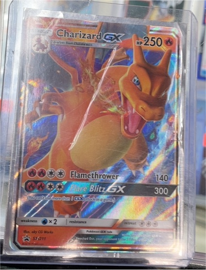 Pokémon TCG Black Star Promo SM211 Charizard GX — front