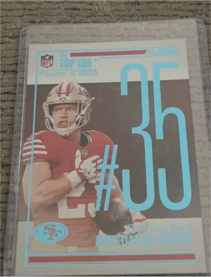 2023 Panini Score Top 100 #35 Christian McCaffrey — front