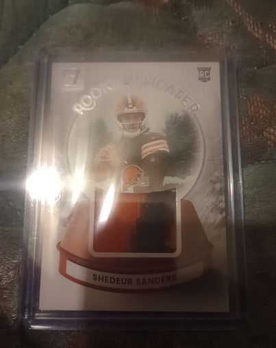 2025 Donruss Football #SWE-SSS Shedeur Sanders Rookie Sweater Relic — front
