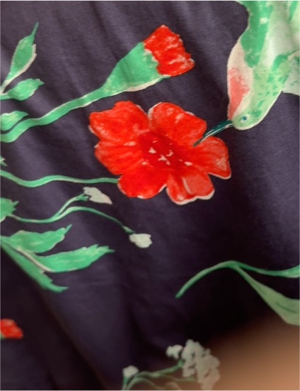 Floral Fabric with Red Flowers and Green Leaves on Dark Background — front