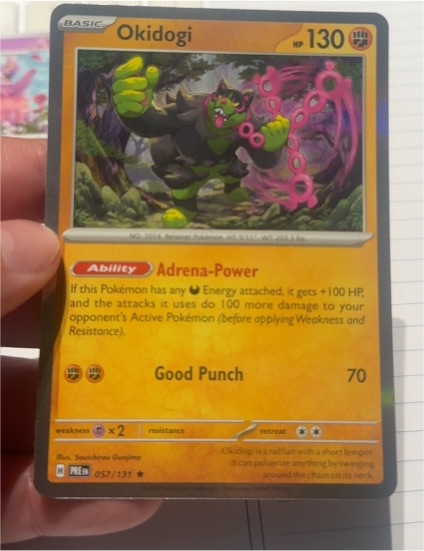 2025 Pokémon TCG Prismatic Evolutions #057 Okidogi — front