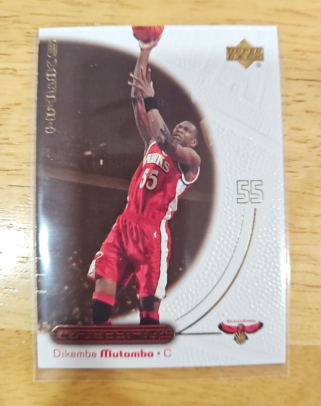 2000-01 Upper Deck Ovation #1 Dikembe Mutombo — front