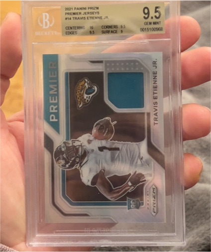 2021 Panini Prizm Premier Jerseys #PJ-14 Travis Etienne Jr. — front