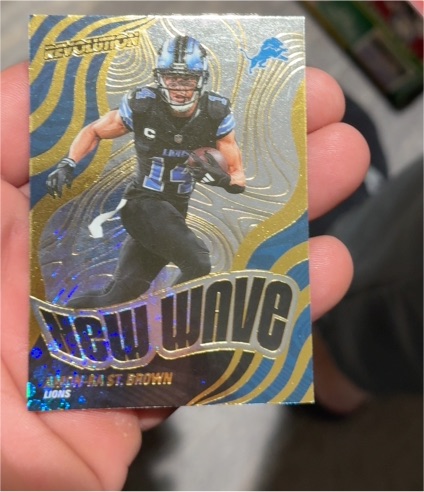 2025 Panini Revolution #20 Amon-Ra St. Brown New Wave — front