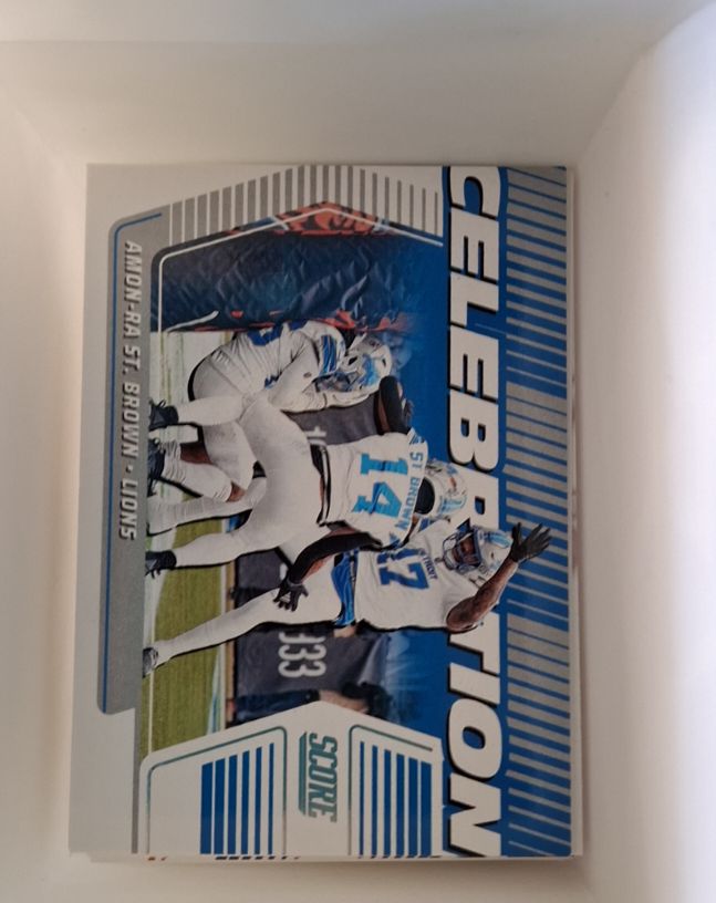 2025 Panini Score #C-AST Amon-Ra St. Brown Celebration — front