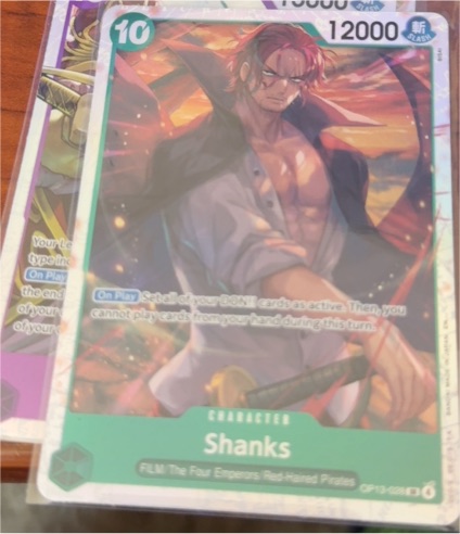 One Piece Card Game OP13-028 Shanks Carrying On His Will — front