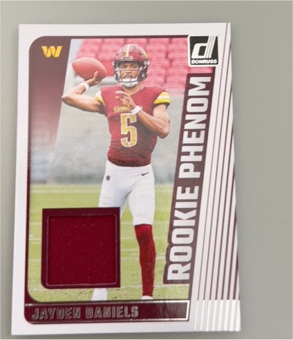 2024 Panini Donruss Rookie Phenom Jerseys #RPJ-JDA Jayden Daniels — front