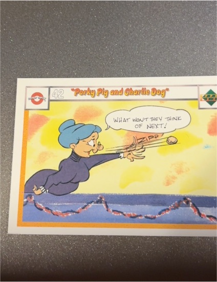 1990 Upper Deck Looney Tunes Comic Ball #42 Porky Pig and Charlie Dog — front