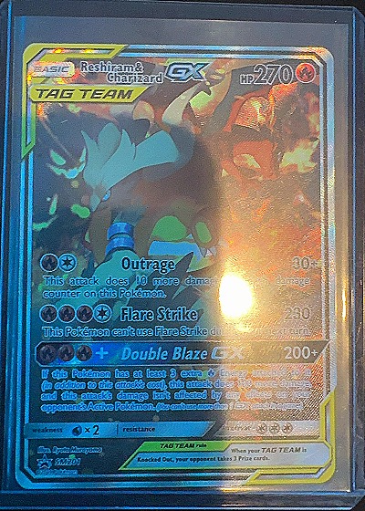2019 Pokémon TCG Black Star Promo #SM201 Reshiram & Charizard GX — front
