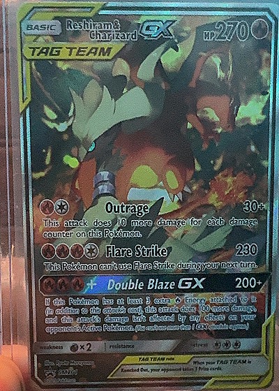 2019 Pokémon TCG Black Star Promo #SM201 Reshiram & Charizard GX — front