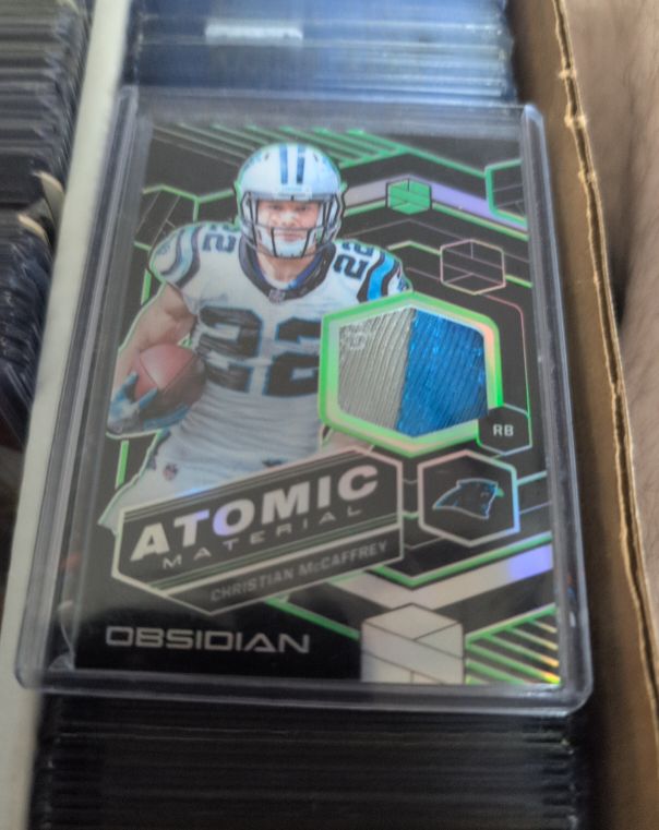 2018 Panini Obsidian Atomic Material #AM-22 Christian McCaffrey — front