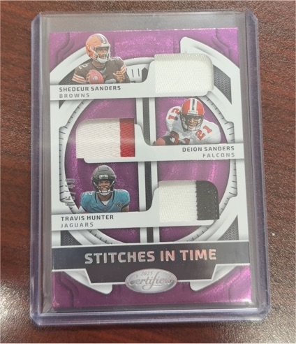 2025 Panini Certified Stitches In Time #SITT-RLD Shedeur Sanders, Deion Sanders & Travis Hunter — front