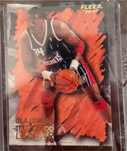 1996-97 Fleer #129 Hakeem Olajuwon Hardwood Leader — front