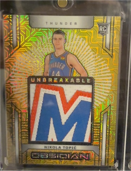 2024-25 Panini Obsidian Unbreakable #UM-NT Nikola Topic — front
