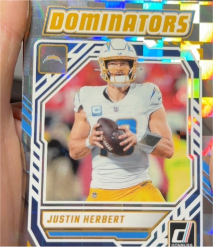 2025 Panini Donruss #DOM-JHT Justin Herbert Dominators — front