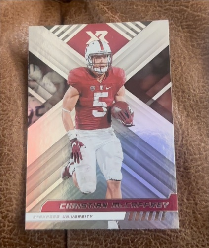 2023 Panini Chronicles Draft Picks XR #18 Christian McCaffrey — front