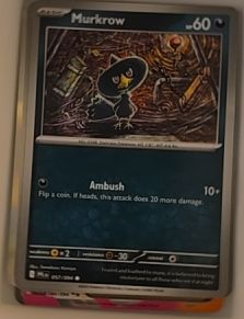 2023 Pokémon TCG Phantasmal Flames #057 Murkrow Reverse Holo — front