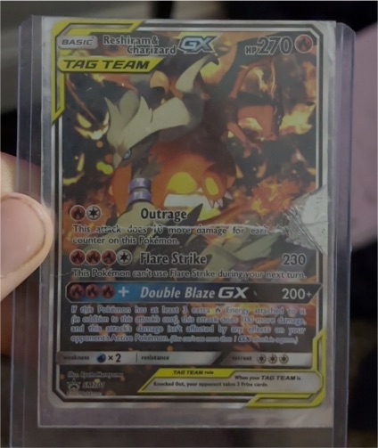 2019 Pokémon TCG #SM201 Reshiram & Charizard GX — front