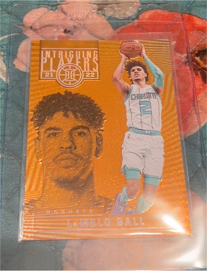 2021-22 Panini Illusions Intriguing Players Orange #17 LaMelo Ball — front